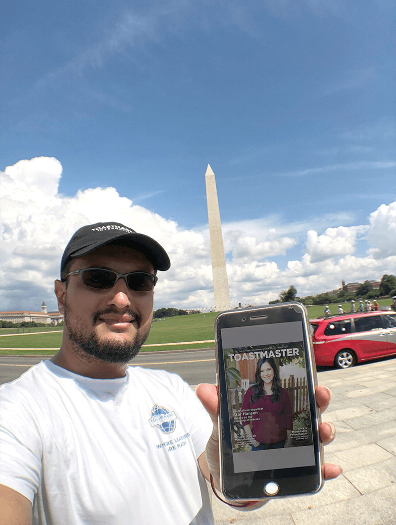 Samer Kamal, DTM, of Riyadh, Saudi Arabia, brings the online Toastmaster magazine to the Washington Memorial in Washington, D.C.