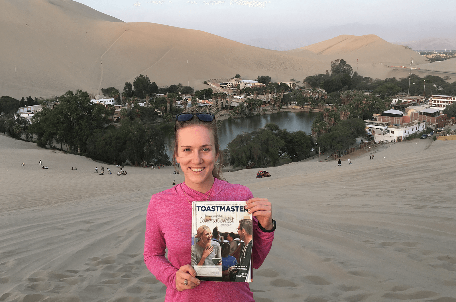 Katrina Schilling, CC, from Katy, Texas, visits an oasis in the desert at Huacachina, Peru.