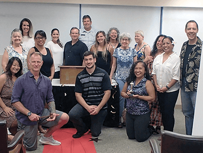 Kauai Toastmasters club gather on red carpet for awards-themed meeting