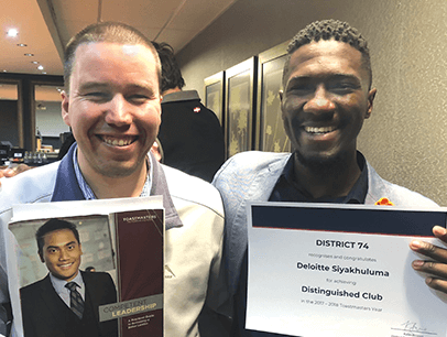 Garth Thomson and Matimu Marcus Manganyi hold Distinguished Club certificate