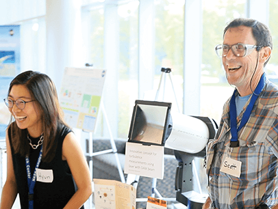 Toastmasters Hyun Jung Kim and Scott Bartram laughing
