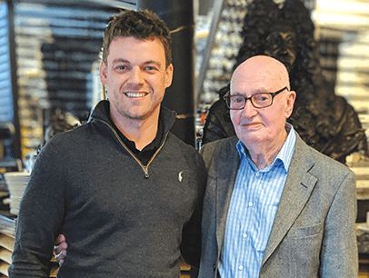 Robert Moores and Alan Thomas stand posing together