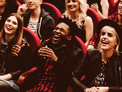 People sitting in audience laughing