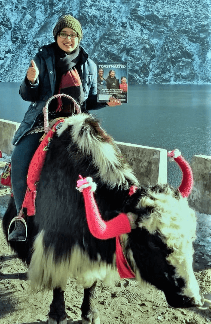 Srilakshmi of Bangalore, India, rides a yak at Tsomgo Lake, a glacial lake in Sikkim, India.