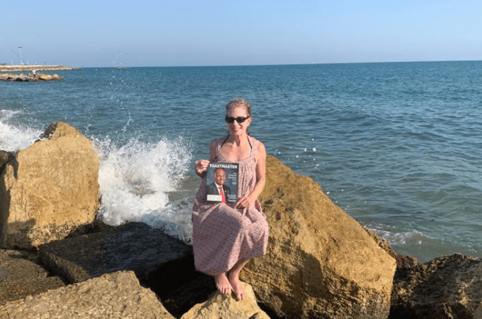 Caryl Lattof of West Roxbury, Massachusetts, sits by the Mediterranean Sea in Anzio, Italy.