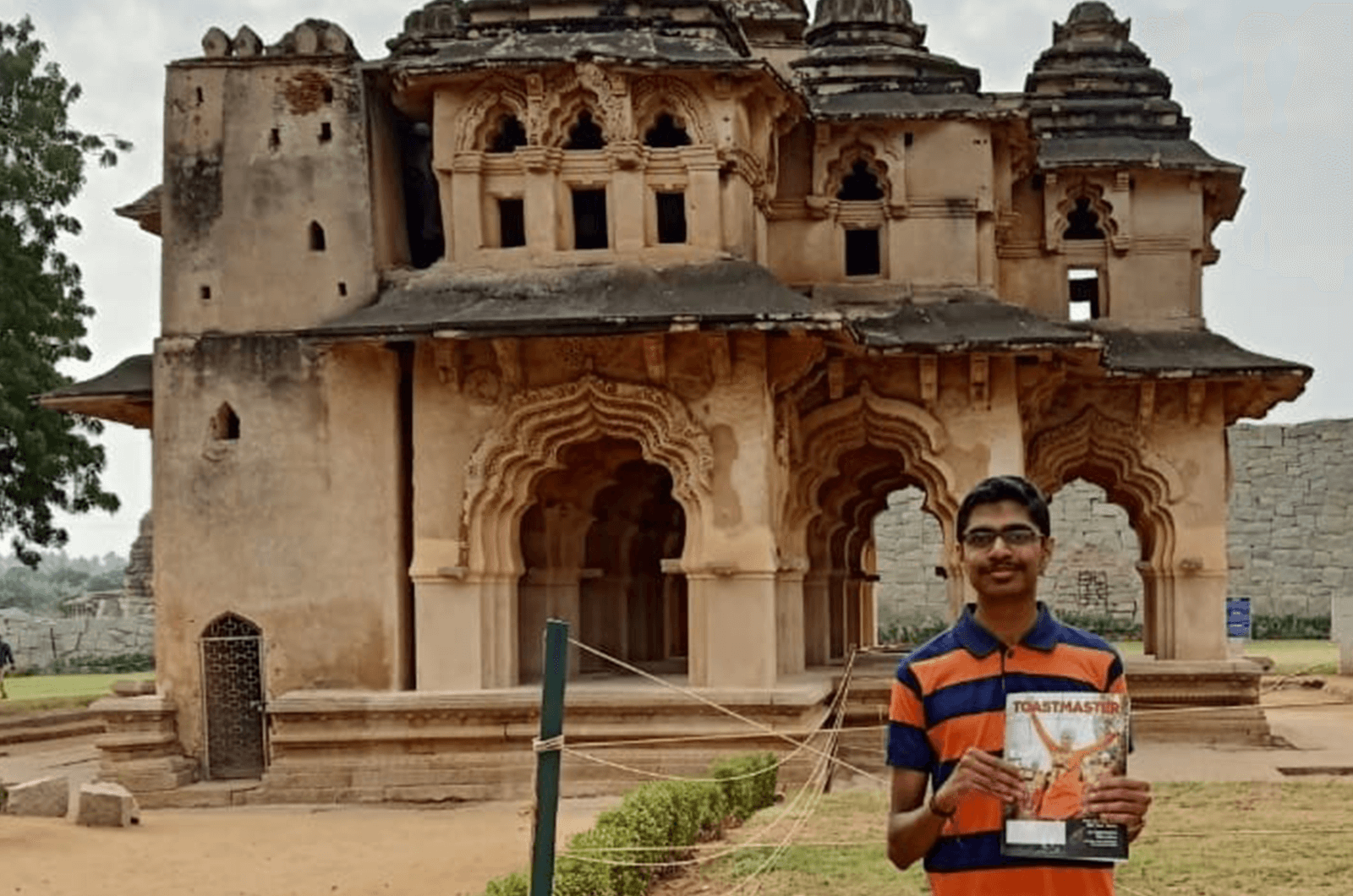 Akash Ravi of Bengaluru, Karnataka, India, visits Hampi, Karnataka, India. In this photo, he stands in front of the Lotus Mahal, where royal families of the Vijayanagara Empire resided.