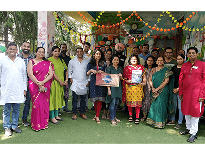 Group of Toastmasters members dressed in traditional Indian garb