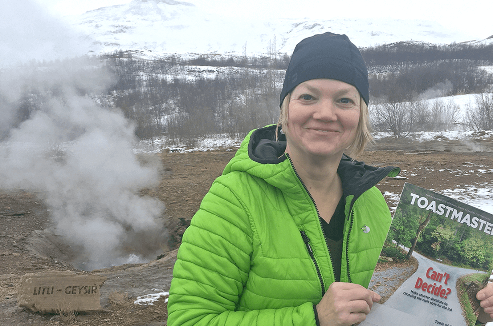 Cathy Mackay of Prince George, British Columbia, Canada, poses in front of a geyser in Haukadalur Valley on the Golden Circle route near Reykjavik, Iceland.