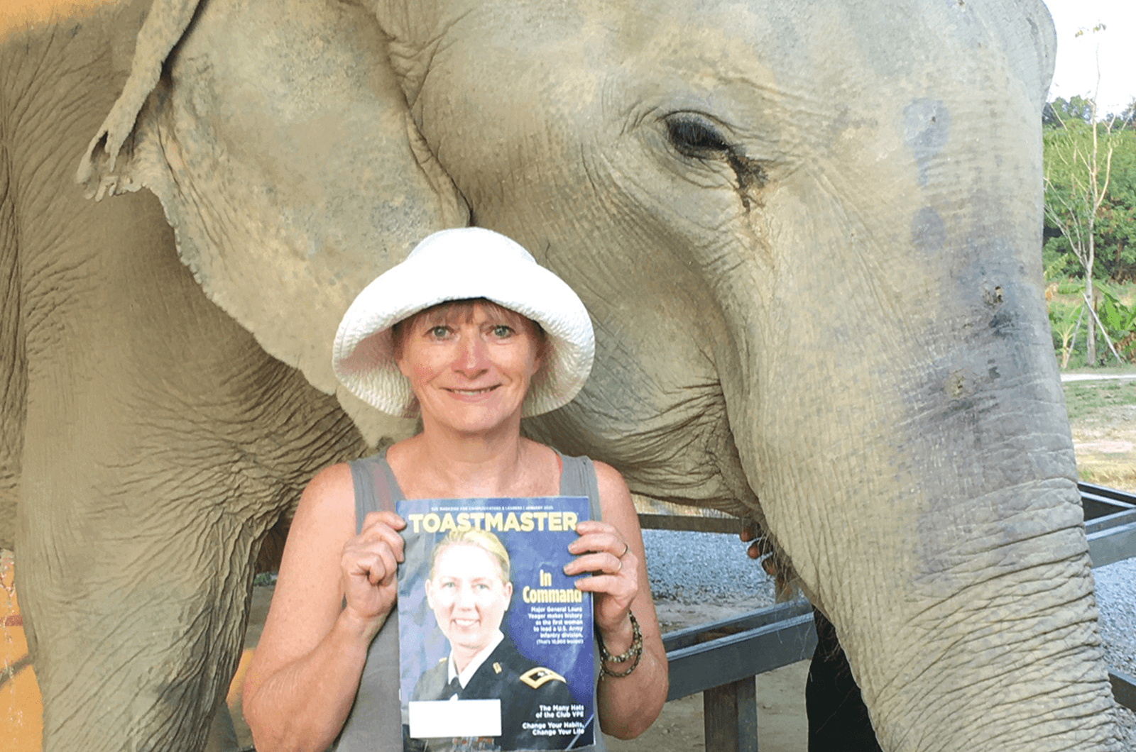 Michèle O'Connell of Milton Keynes, England, U.K., stands with the matriarch elephant of the Elephant Jungle Sanctuary near Pattaya City, Thailand. She says both she and the elephant are the same age and retired.