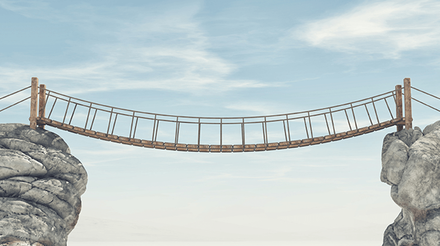 Image of a bridge reaching across two rocks