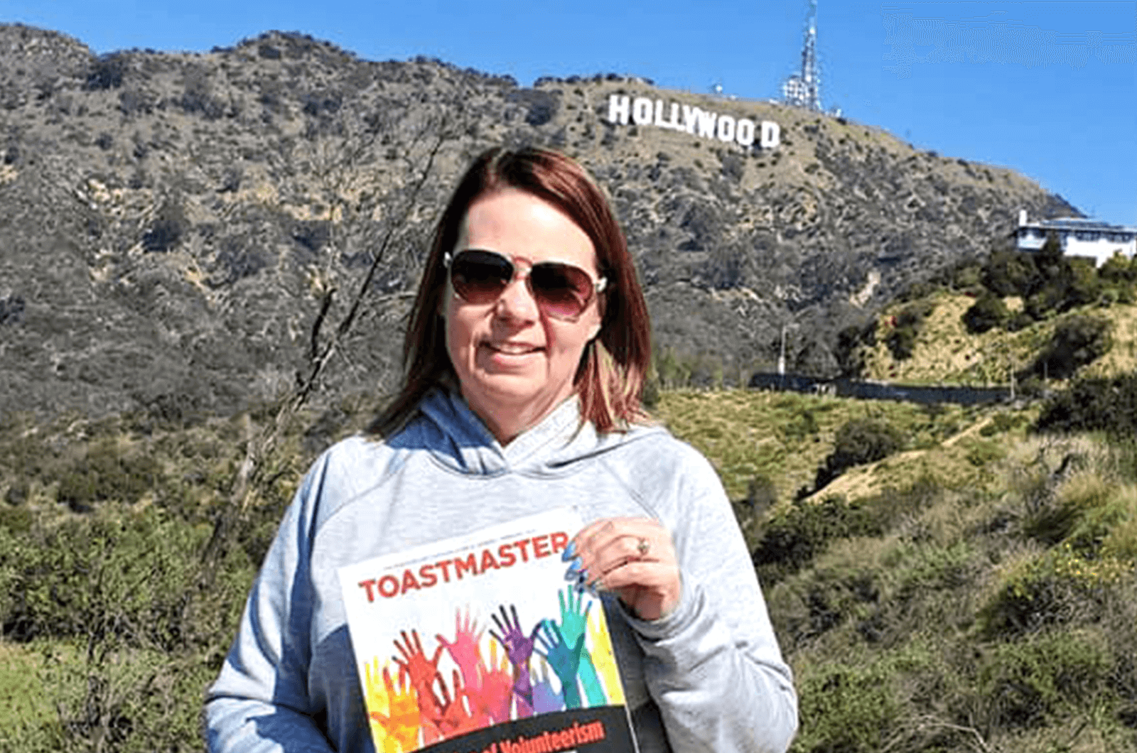 Billie Sutherland, DTM, of Fargo, North Dakota, visits the Hollywood sign in Los Angeles, California.
