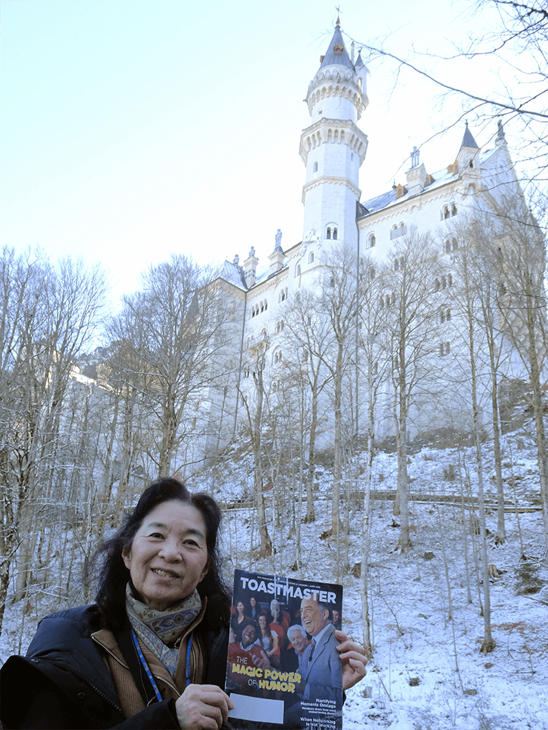 Chizuru Fukunaga of Shimonoseki, Yamaguchi, Japan, stands below Neuschwanstein Castle in Schwangau, Germany. The 19th century castle was intended as a retreat for Ludwig II of Bavaria before he died in 1886.