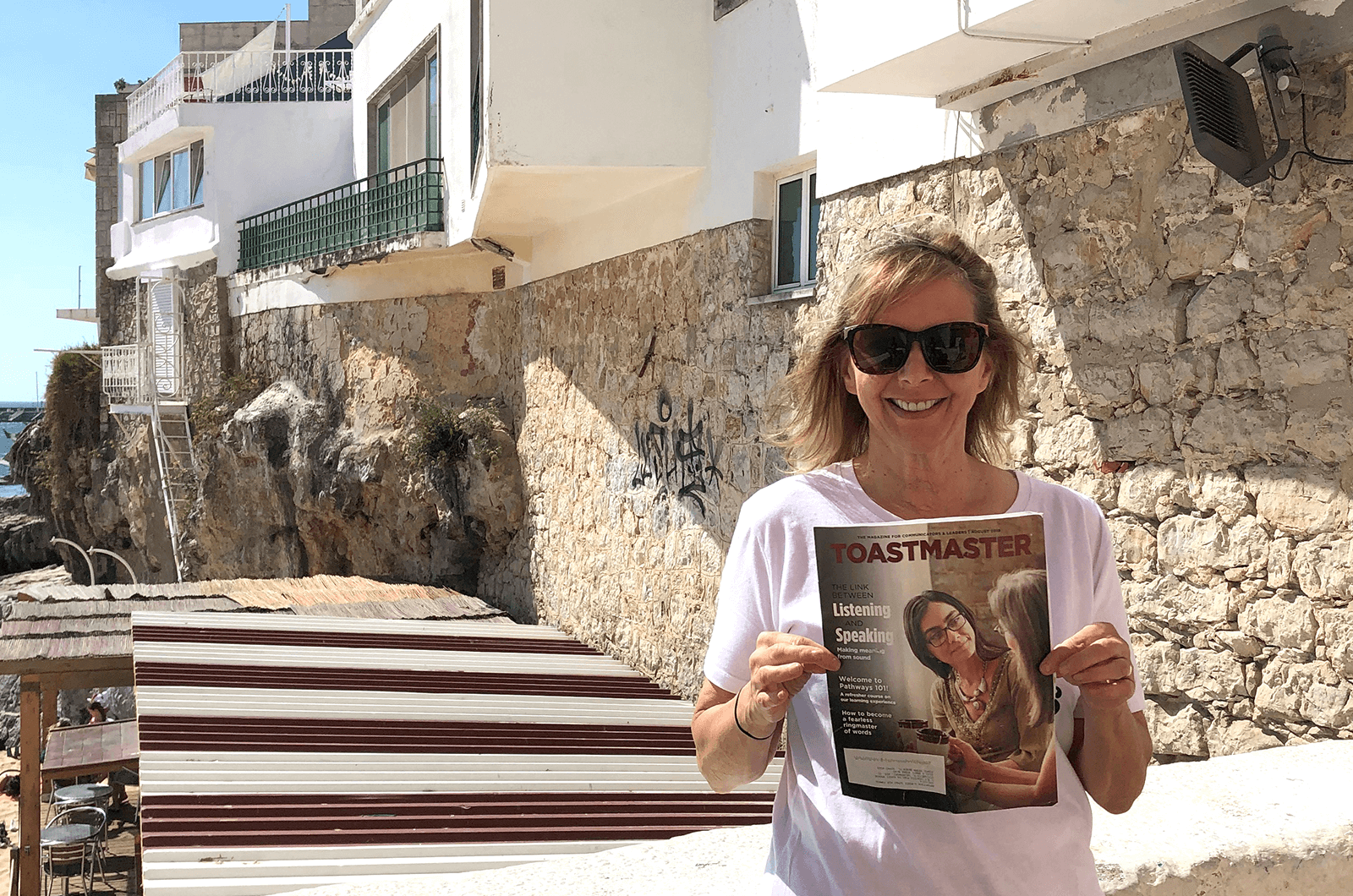 Liz Trendowski of Ponte Vedra Beach, Florida, shows off her Toastmasters pride in Portugal.