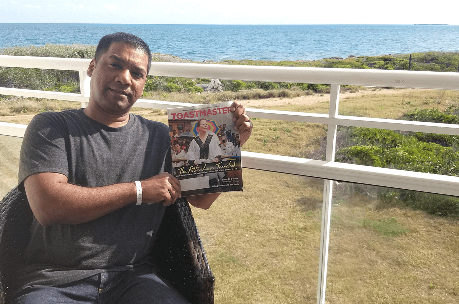 Wavell Pinto of Brampton, Ontario, Canada, reads his Toastmaster on his balcony in Cayo Coco, Cuba.