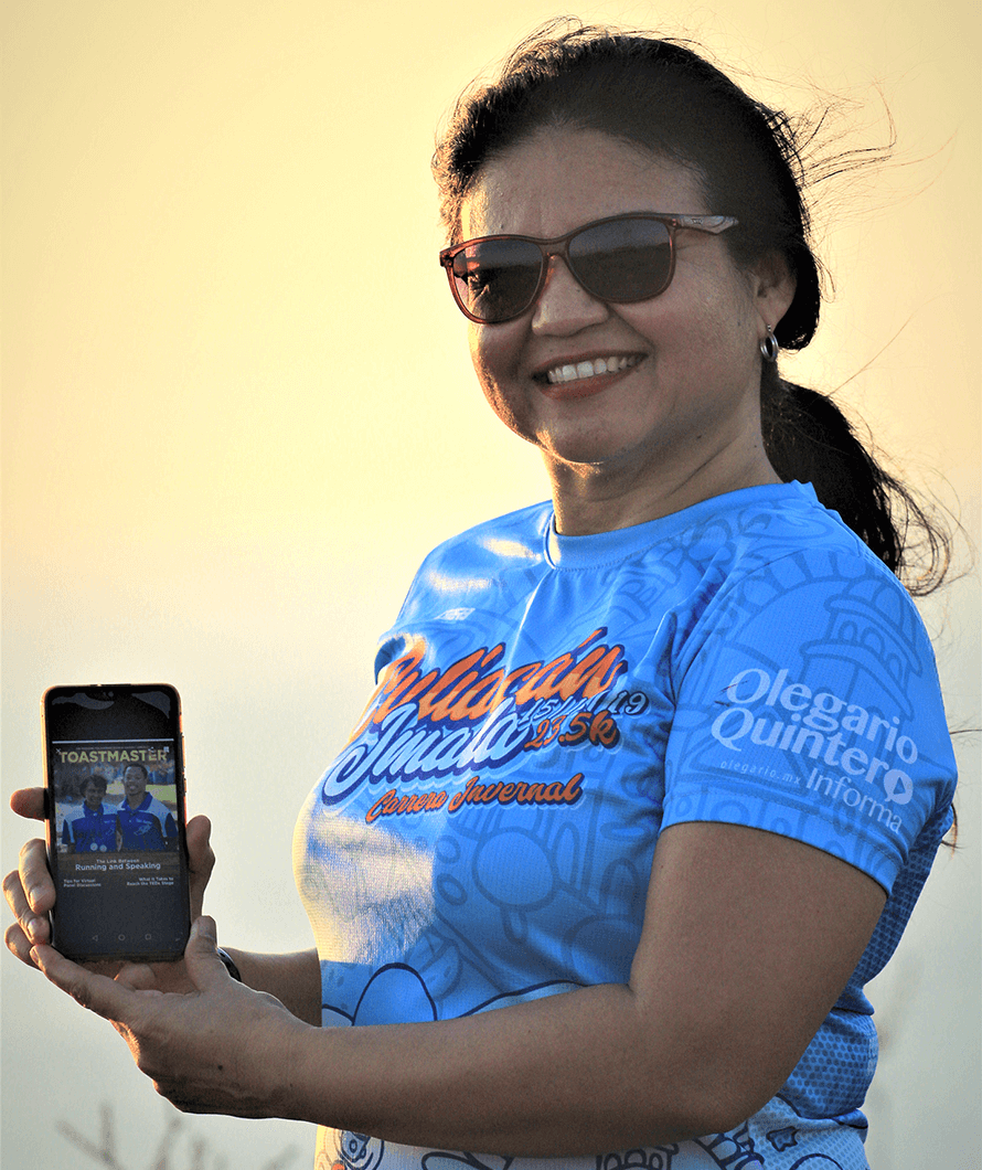 Sandra E. Meza of Culiacan, Sinaloa, Mexico, pauses during a run in La Paz, Baja California Sur, Mexico, to snap a picture with the digital Toastmaster.