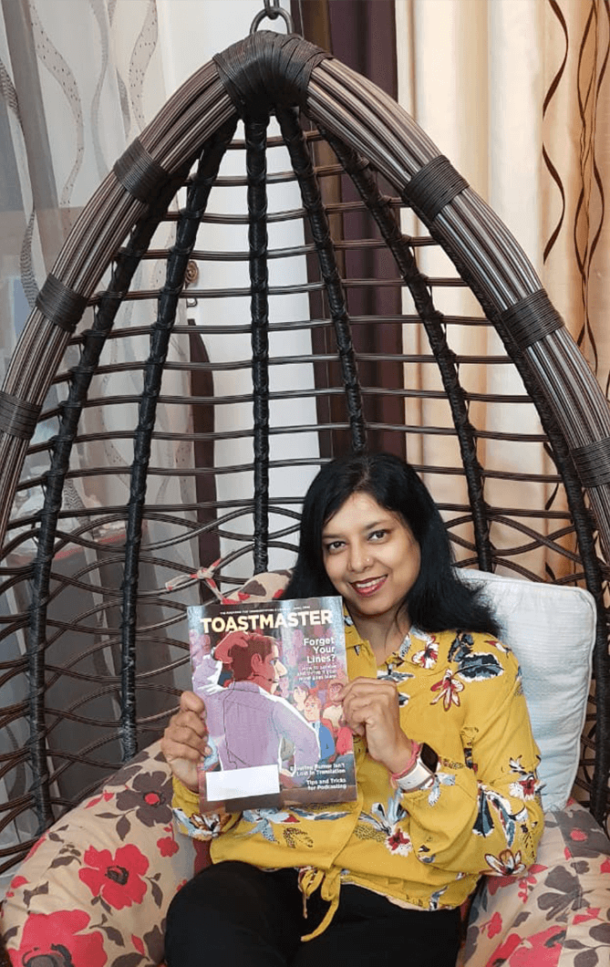 Soni Budhia of Muscat, Oman, enjoys reading her Toastmaster while staying at home during COVID-19 restrictions.