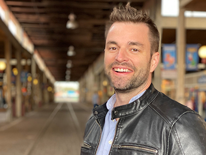 Man smiling in leather jacket