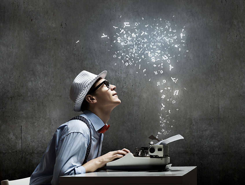 Man working on typewriter