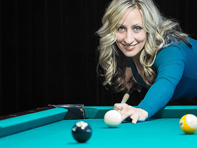 Woman playing pool