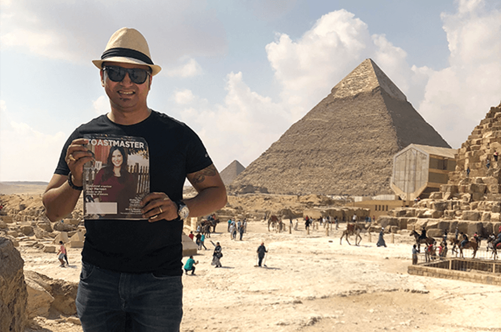 Christopher Keith Almeida, DTM, of Doha, Qatar, stands near the Great Pyramid of Giza, also known as the Pyramid of Khufu, in Cairo, Egypt, prior to the pandemic.