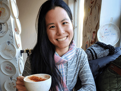 Woman holding big cup of coffee