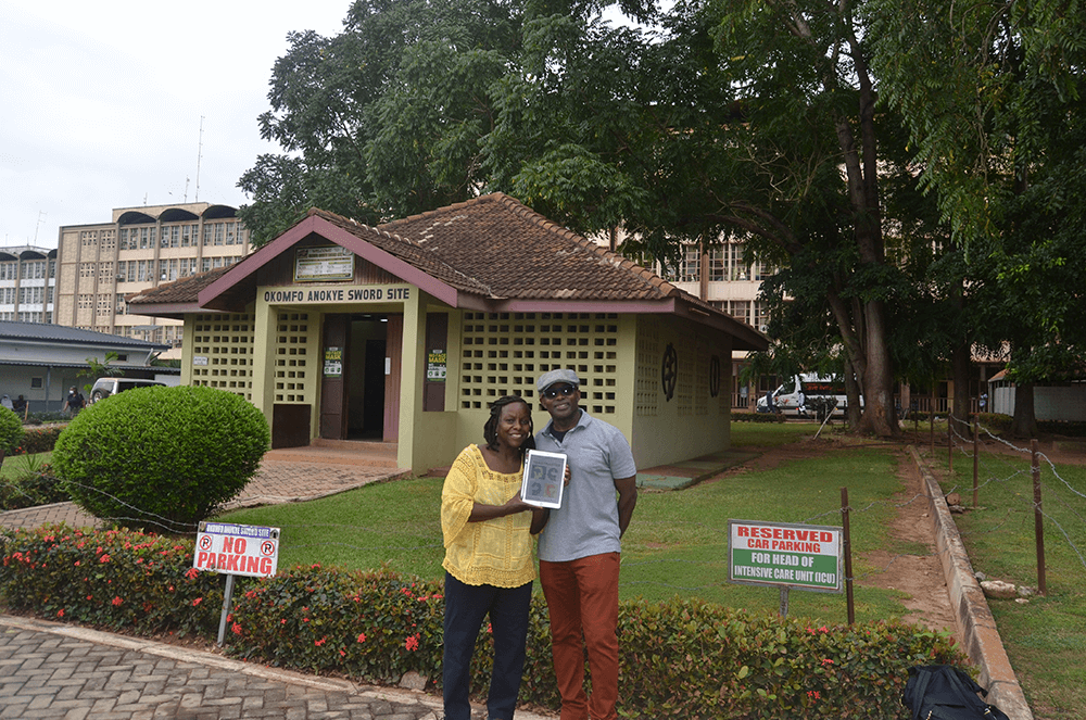 Ronda Hetterson and Charles Pumpuni, both of Springfield, Virginia, visit the Komfo Anokye Sword Site in Kumasi, Ghana. Legend states that the sword has been wedged in stone for more than 300 years and cannot be moved—a symbol of the unity and strength of the Ashanti people.