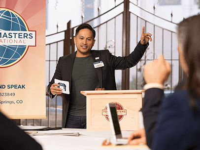 Man speaking at lectern