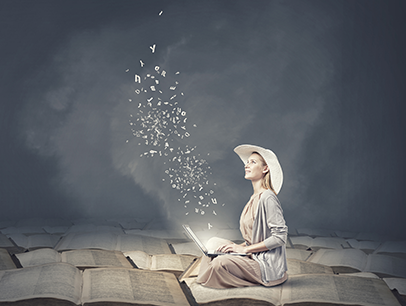 Woman in hat writing on laptop