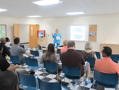 Woman speaking in front of audience
